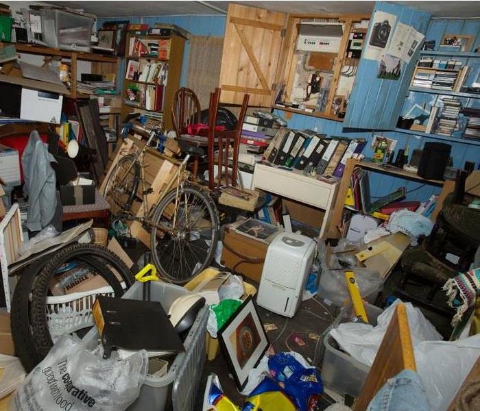 A room in a home filled with possessions, debris and refuse creating a dangerous hoarding situation